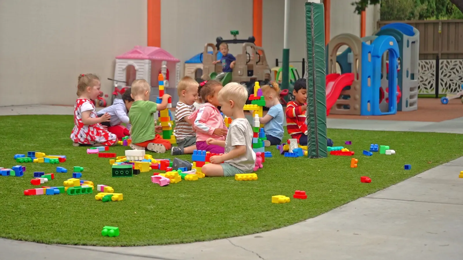 Children building together outdoors at the San Jose campus