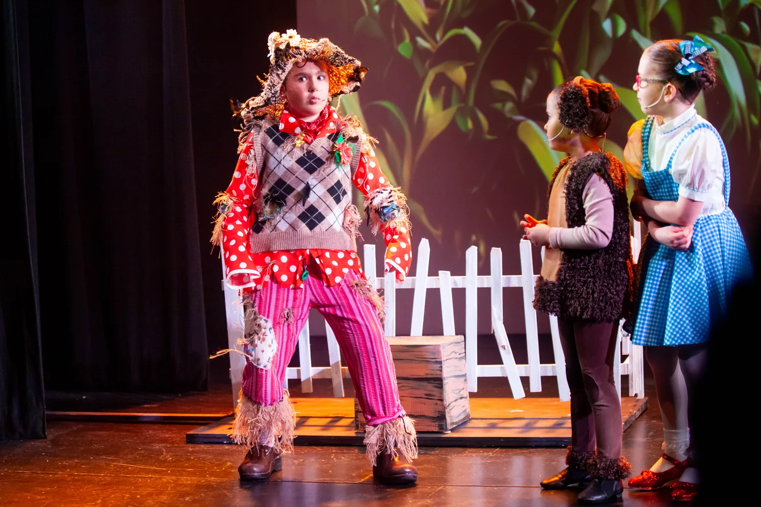 Starbright students performing a Wizard of Oz scene onstage